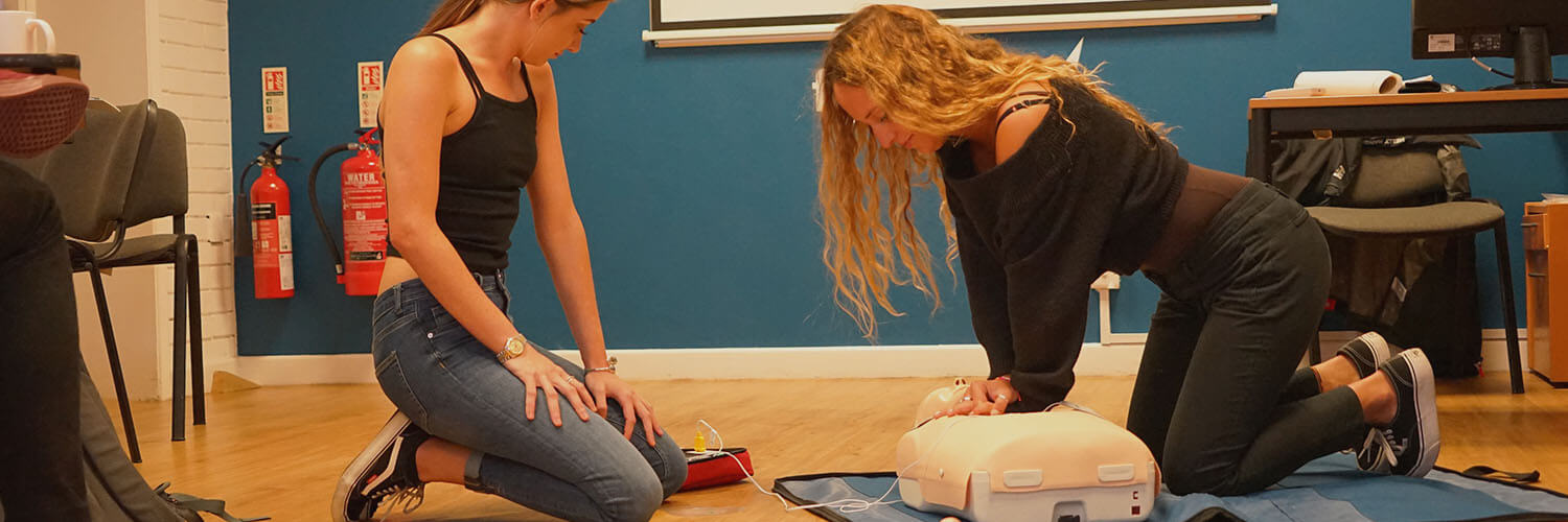 Practical CPR exercise during classroom first-aid training