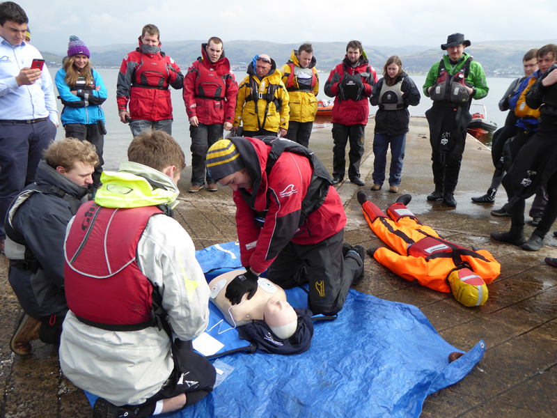 Students practising marine first aid and CPR during an RYA course